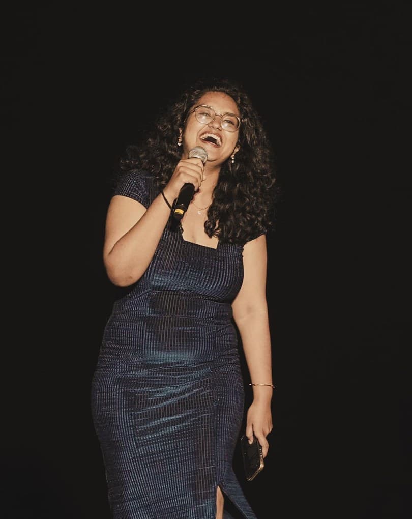 Subhalakshmi (Subbu) — voice artist, event emcee and ex-Fever 91.9 FM RJ on stage with microphone